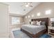 Serene bedroom featuring a window seat, high ceilings, and a neutral color palette at 4846 E Piccadilly Rd, Phoenix, AZ 85018