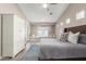 Bright main bedroom boasts an ensuite bath and a door to the backyard at 4846 E Piccadilly Rd, Phoenix, AZ 85018