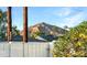 Charming neighborhood view with mountain backdrop, landscaping, and white fence, creating a serene setting at 4846 E Piccadilly Rd, Phoenix, AZ 85018