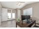 Modern office featuring French doors, dual monitors, and neutral tones for a productive workspace at 4846 E Piccadilly Rd, Phoenix, AZ 85018
