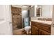 Updated bathroom featuring a tiled shower with glass door, sleek fixtures, and modern vanity at 5046 N 81St St, Scottsdale, AZ 85250