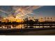 Scenic sunset view of a community lake with palm trees and iconic mountain in the background at 5046 N 81St St, Scottsdale, AZ 85250