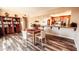 Open concept dining room flows into modern kitchen featuring granite countertops and stainless steel appliances at 5046 N 81St St, Scottsdale, AZ 85250