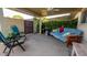 Inviting covered patio with comfortable seating, lush greenery, and relaxing atmosphere at 5046 N 81St St, Scottsdale, AZ 85250