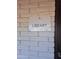 The library has an exterior view with a clear and visible sign on a brick wall at 5201 W Camelback Rd # A7, Phoenix, AZ 85031