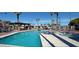 Community pool with lounge chairs and umbrellas offers a great place for outdoor recreation at 5201 W Camelback Rd # A7, Phoenix, AZ 85031