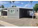 Exterior of home with a covered driveway offers shade and protection from the elements at 5201 W Camelback Rd # A7, Phoenix, AZ 85031