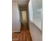 Hallway has wood floors and window with blinds at 5201 W Camelback Rd # A7, Phoenix, AZ 85031