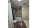 Bathroom featuring a walk-in shower with tile surround, modern fixtures, and a gray bath mat at 523 S Park View Cir, Mesa, AZ 85208
