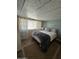 Comfortable bedroom featuring a bed with decorative pillows, stylish curtains, and 'home sweet home' sign at 523 S Park View Cir, Mesa, AZ 85208