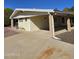 Charming single-story home with a covered carport, low maintenance landscaping, and desert accents by the front door at 523 S Park View Cir, Mesa, AZ 85208