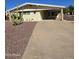 Charming single-story home with a covered carport, low maintenance landscaping, and a desert cactus in the front yard at 523 S Park View Cir, Mesa, AZ 85208