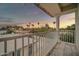 Balcony view of the neighborhood at dusk, featuring palm trees and a lovely sky at 5338 N 21St Ave, Phoenix, AZ 85015