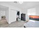 Bright bedroom with tile flooring, a dresser, closet, and a single window at 5338 N 21St Ave, Phoenix, AZ 85015