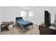 Neutral-toned bedroom has a small table, tile flooring, and a dresser in view at 5338 N 21St Ave, Phoenix, AZ 85015