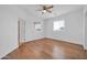 A spacious bedroom with wood floors and a ceiling fan has a view from two windows at 5338 N 21St Ave, Phoenix, AZ 85015