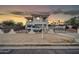 Home with a gated entrance, balcony, and a two-car garage at 5338 N 21St Ave, Phoenix, AZ 85015
