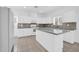 Modern kitchen featuring white cabinets, granite counters, and an island at 5338 N 21St Ave, Phoenix, AZ 85015