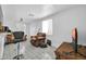 Living room with tile flooring, a large window, and multiple chairs at 5338 N 21St Ave, Phoenix, AZ 85015