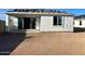 New home's backyard features sliding glass doors and a window under construction, promising ample natural light at 5633 W Mcneil St, Laveen, AZ 85339