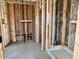 An in-progress bathroom reveals its plumbing, framing, and a shower base, showcasing the layout at 5633 W Mcneil St, Laveen, AZ 85339
