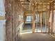 Interior view of unfinished home showcasing wood framing and insulation at 5633 W Mcneil St, Laveen, AZ 85339