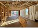Interior view of unfinished living space showing framing, insulation and sliding glass doors at 5633 W Mcneil St, Laveen, AZ 85339