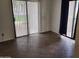 Bright room featuring tile flooring, neutral colored walls, vertical blinds, and sliding door at 5757 W Eugie Ave # 1102, Glendale, AZ 85304