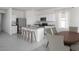 Bright, open-concept kitchen featuring granite countertops, stainless steel appliances, and a breakfast bar at 5839 W Willow Ridge Dr, Laveen, AZ 85339