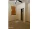 Neutral carpeted bedroom with a ceiling fan, window blinds and a closet at 61 W Hackberry Dr, Chandler, AZ 85248
