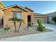 Beautiful single-story home with desert landscaping, palm trees and a two-car garage at 61 W Hackberry Dr, Chandler, AZ 85248