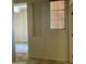 Neutral hallway enhanced by tile floor, window and built-in wall niche at 61 W Hackberry Dr, Chandler, AZ 85248