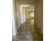 Hallway with tile flooring, neutral paint and views into the living room at 61 W Hackberry Dr, Chandler, AZ 85248