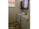 Laundry room with tile flooring, cabinets, and a white washer and dryer at 61 W Hackberry Dr, Chandler, AZ 85248