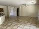 Spacious open living room with tile floors, neutral paint, and a ceiling fan at 61 W Hackberry Dr, Chandler, AZ 85248
