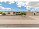 Charming single-story home with a well-manicured lawn and a two-car garage at 6217 E El Paso St, Mesa, AZ 85205