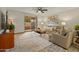Comfortable living room with stylish decor, tile flooring, and access to the patio at 6217 E El Paso St, Mesa, AZ 85205
