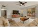 Open living room featuring neutral tones, sliding glass doors, and tiled floor at 6217 E El Paso St, Mesa, AZ 85205