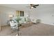 A spacious living room with ample seating, decorative lighting, and a large window at 6217 E El Paso St, Mesa, AZ 85205