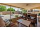 Relaxing covered patio features comfortable seating and views of the well-maintained backyard at 6217 E El Paso St, Mesa, AZ 85205