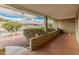 Cozy front porch with brick detail and colorful flower bed, providing a charming welcome at 6217 E El Paso St, Mesa, AZ 85205