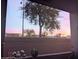 Balcony view overlooking desert landscape with sunset hues in the sky and flowering plants in the foreground at 7009 E Acoma Dr # 1101, Scottsdale, AZ 85254