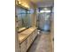 Bathroom featuring a double sink vanity and a glass door shower at 7009 E Acoma Dr # 1101, Scottsdale, AZ 85254