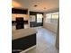 Dining area with tile flooring, modern lighting, and a view of the open kitchen at 7009 E Acoma Dr # 1101, Scottsdale, AZ 85254