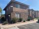 Charming condo featuring a stone facade and lush landscaping, creating a welcoming curb appeal at 7009 E Acoma Dr # 1101, Scottsdale, AZ 85254