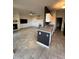 Open-concept living room with tile floors, a fireplace, tv, and views into the kitchen at 7009 E Acoma Dr # 1101, Scottsdale, AZ 85254