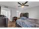 Spacious bedroom features a modern ceiling fan, multiple closets and natural light at 9396 E Purdue Ave # 220, Scottsdale, AZ 85258