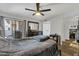 Spacious primary bedroom features an ensuite bath, patio access, and a large closet at 9396 E Purdue Ave # 220, Scottsdale, AZ 85258