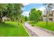 Walkway through the lush, landscaped grounds at 9396 E Purdue Ave # 220, Scottsdale, AZ 85258