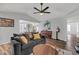 Bright living room showcases modern furnishings, natural light, with dark wood floors and vaulted ceilings at 9396 E Purdue Ave # 220, Scottsdale, AZ 85258